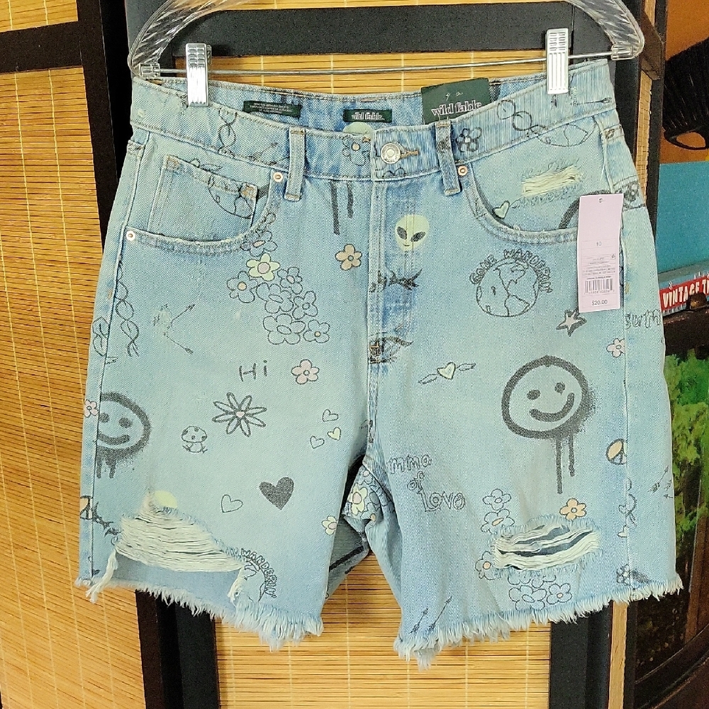 Playful Graphic Denim Shorts with Distressed Hem